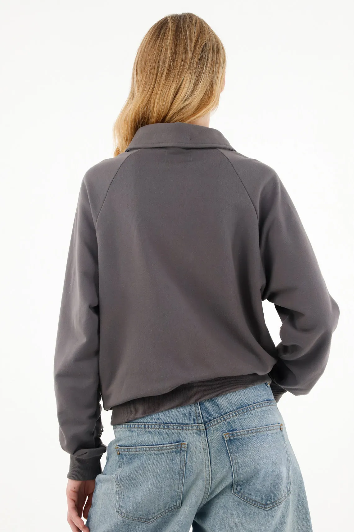 Buzo gris oversize con apliques de brillo para mujer